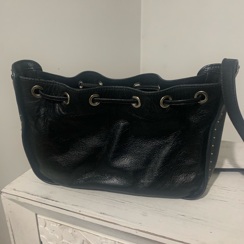 Black leather Barney’s New York bag